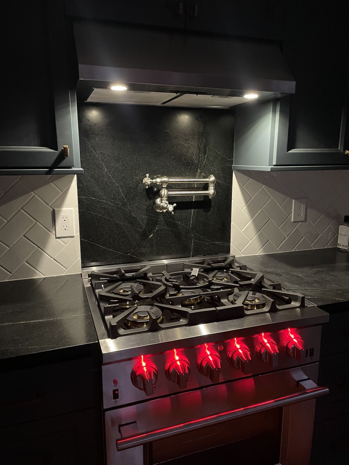 Range and soapstone backsplash